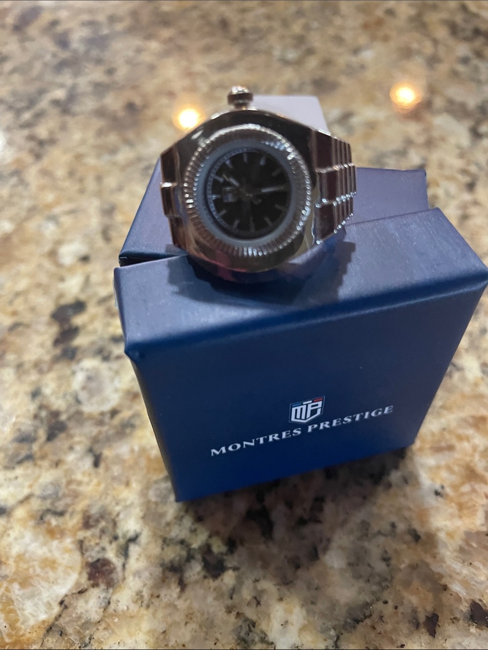 Montres Prestige Womenโs Silver Ring Watch with Black Dial